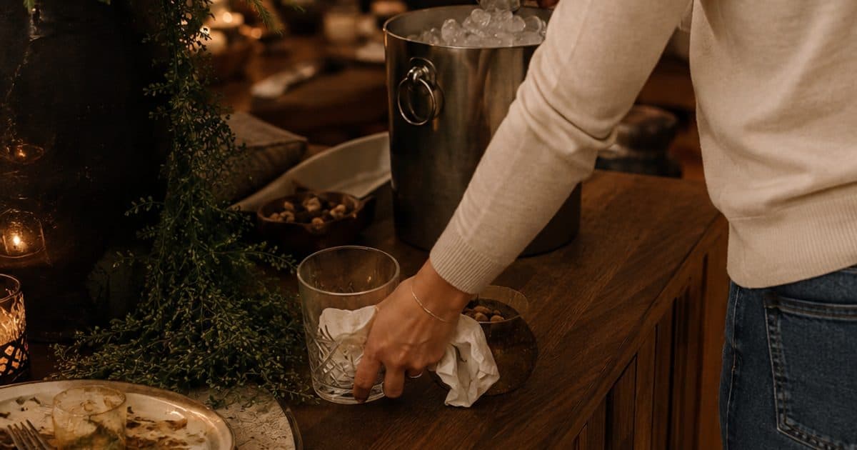 Simple during-party reset loop showing food safety, drinks and ice, used dishes and trash, bathroom basics, and guest-flow checks